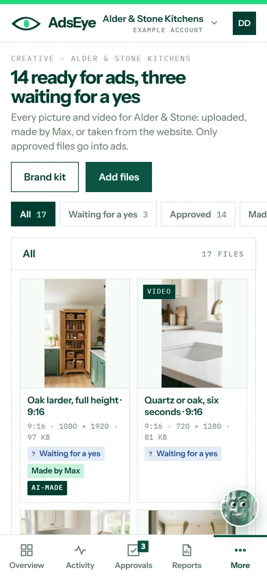 The creative library on a phone: fourteen files ready for ads and three waiting for a yes, with buttons for the brand kit and adding files